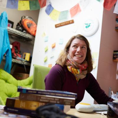 Female faculty member works in her office